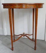 An Edwardian oval satinwood occasional table, the top frieze on slender legs, painted floral