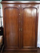 Late Victorian/Edwardian mahogany compactum wardrobe by A. Gardiner & Sons, Cabinet Maker, Jamaica