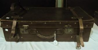 Leather suitcase, expandable with straps and having insert with pockets, inscribed "....UAT & Co.,