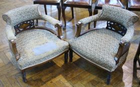 Pair Edwardian tub chairs, with floral upholstery and padded arms and stuff-over seats, with