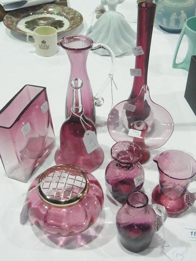 Collection of cranberry glass  to include:- assorted vases, jug, bell and other items (9)