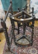 Twentieth century stained oak umbrella stand, with turned carved columns, wooden gong stand, (gong