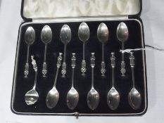 Twelve silver apostle coffee spoons by Mappin and Webb, London 1936, cased (1 damaged)