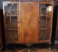 Mid-twentieth century walnut china display cabinet, having pair astragal glazed end doors flanking