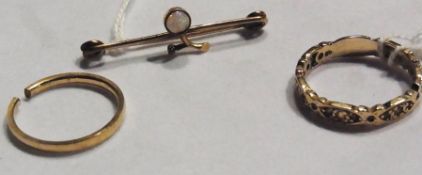 Gold coloured metal and opal bar brooch, 9ct gold white stone set eternity ring and a 9ct gold