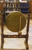 Victorian oak and brass gong on stand, with turned gallery rail top, hammered brass gong, on