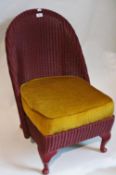 Lloyd Loom style single chair with sprung seat, raised on short cabriole legs