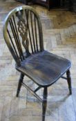 Set of four nineteenth century elm and beech wheel back Windsor chairs with solid seats, on turned