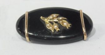 Victorian black onyx, gold-coloured metal and seedpearl brooch, oval with floral spray decoration