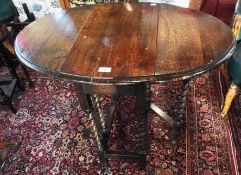 Twentieth century stained oak gate-leg table, with spiral turned supports, 89cm wide