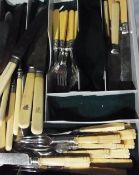 Quantity of carved bone handled dessert knives and forks, sundry yellow handled table knives,