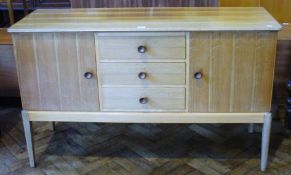 Gordon Russell walnut and hardwood sideboard, the top with rounded corners, slight ogee edge, fitted