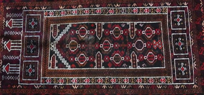 Persian design wool rug, the rectangular central medallion with multiple floral borders, length