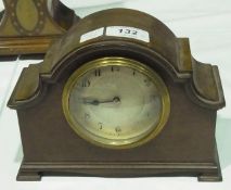 Early 20th century figured walnut timepiece with broken arch pediment, engine-turned dial on bracket