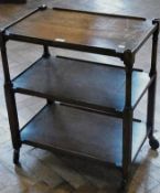 Twentieth century stained oak three-tier trolley, on castors