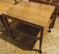 1970s mahogany two-tier trolley table, rectangular on square tapering supports and large castors,