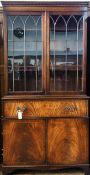 Reproduction Georgian style mahogany glazed secretaire bookcase with a dental frieze, a pair of