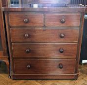 A Victorian mahogany chest of two short and three long graduated drawers raised on bun feet, width