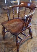 A Victorian smoker's chair, with turned spindle back, solid elm seat on turned legs united by