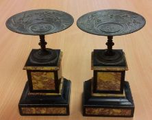 Pair empire style bronze tazze, each embossed with classical horse drawn chariot and surround of