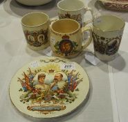 Staffordshire King Edward VII Coronation plate, three Coronation mugs various and a George V