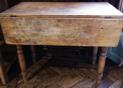 A Victorian pine drop flap kitchen table, with frieze drawer, on turned legs, 90cm long