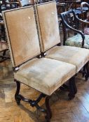 A pair of Spanish/Portuguese antique side chairs, each with a rectangular upholstered back and