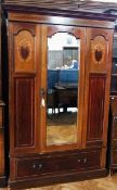 Edwardian mahogany and satinwood inlaid wardrobe, with bevelled mirror plate door enclosing