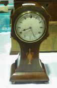 An Edwardian mahogany cased mantel clock with satinwood vase inlay and enamel convex dial