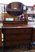 Early twentieth century stained oak mirror back dressing chest, with three long drawers, raised on