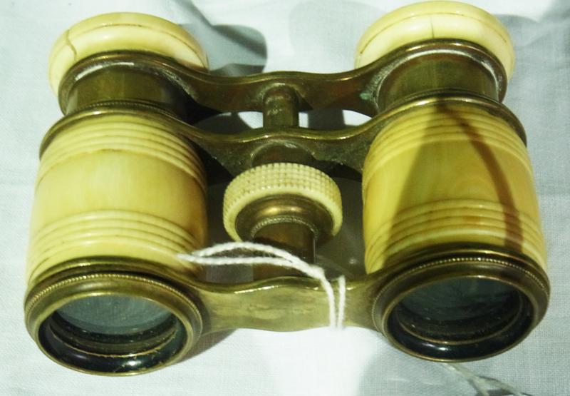 A pair simulated ivory and brass opera glasses together with a Chinese style paper parasol (2)