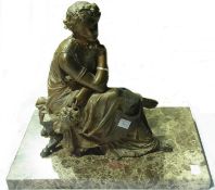 Spelter classical female allegorical figure, seated and holding a mask, on bench with hoof feet,