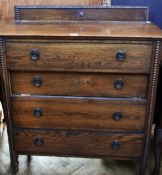 Early twentieth century oak chest with split bobbin moulding surround, four long drawers on turned