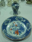 Chinese porcelain blue and white dish together with a Chinese blue and white ovoid shaped vase