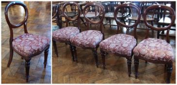 A set of four Victorian mahogany balloon back dining chairs, with upholstered stuffover seats, on