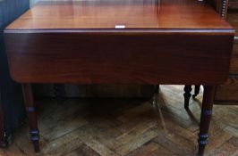 Nineteenth century mahogany drop flap dining table with frieze drawer opposed to a dummy on ring