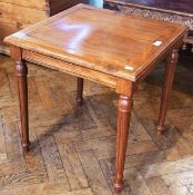 A modern hardwood square top occasional table, with moulded edge, plain frieze on turned tapering