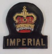 An Imperial pressed copper fire mark, painted crown mounted on wooden plaque, 22cm high