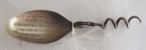 Folding metal medicine spoon, with corkscrew handle, inscribed "Tabloids of Compressed Drugs,