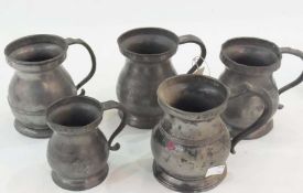 Four Victorian pewter pint measures, one marked VR324, and a half pint pewter measure, marked VR154,