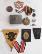 Collection of military ribbons, badges and buckle