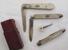 Georgian silver and mother-of-pearl handled folding knife and fork, each with engraved blade, floral