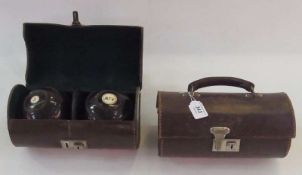 Two pairs inlaid hardwood bowling balls, in leather carrying cases
