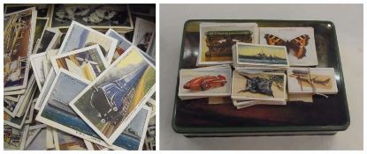 A large collection of cigarette cards to include:- "Churchmans Treasure Trove", "Players Motorcars",