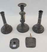 Pair pewter candlesticks, mark to base 1769, another pewter candlestick, a pewter plaque "Canterbury