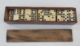 Cased set of bone and ebony dominoes