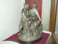 A terracotta figure group of a courting couple with basket of flowers H x 36 cm