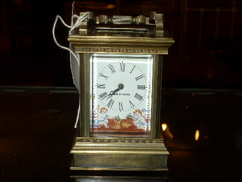 A miniature brass carriage clock with coloured enamel dial H 10 cm