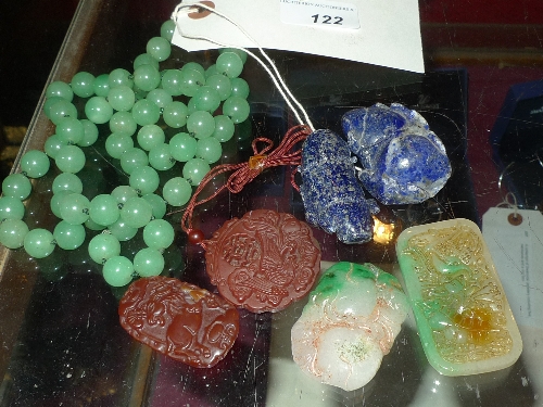 A green jade style ladies necklace and a collection of six Chinese pendants