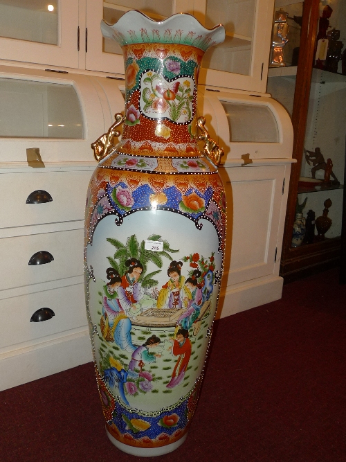 A Japanese porcelain vase of large size with painted reserve of Geisha girls in traditional costume